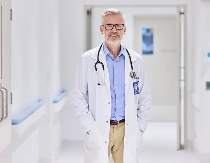A doctor standing in a hospital corridor